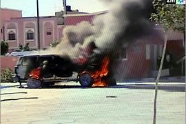 CORRECTING : residents -- RESTRICTED TO EDITORIAL USE -- MANDATORY CREDIT AFP/2M TVTV grab released by Moroccan TV channel 2M on November 8, 2010 shows a car burning during fightings between residents and Moroccan police forces during a police raid in a refugee