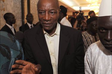 f_Guinea's presidential candidate Alpha Conde leaves the presidential palace after a meeting with Guinea's president of the interim government, General Sekouba Konate (not