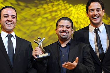 Egyptian director Ahmed Abdallah (C), Egyptian Actor Khaled Abol Naga (R) and Egyptian producer Ataf Yussef are pictured with the Tanit d'or trophy for Abdallah 's film "Microphone" during the closing ceremony of the 23nd Carthage International Film Festival (JCC) in Tunis' municipal theater on October 31, 2010 in Tunis