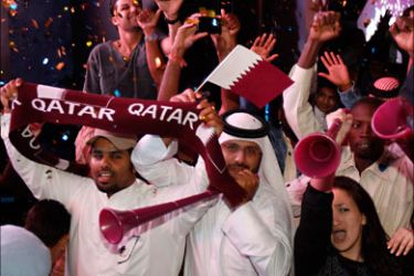 r_Qatari fans celebrate at Souk Waqif in Doha December 2, 2010, after the announcement that Qatar will host the 2022 World Cup. Summer temperatures which can soar to above 50