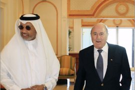 Mohamed Bin Hammam, the president of the Asian Football Confederation (AFC), receives FIFA President Sepp Blatter (R) upon his arrival at Doha