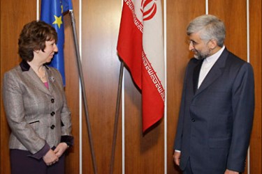 r_EU foreign policy chief Catherine Ashton (L) greets Saeed Jalili, Iran's chief nuclear negotiator in the foyer of the conference centre near the Swiss mission to the United