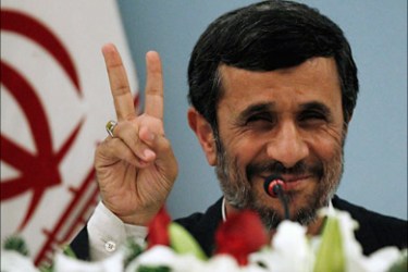 r_Iranian President Mahmoud Ahmadinejad flashes the victory sign as he addresses the media during a news conference in Istanbul December 23, 2010.