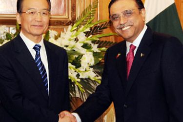 epa02500486 A handout picture released by the Press Information Department on 18 December 2010 shows China's Prime Minister Wen Jiabao (L) shaking hands with Pakistan's President Asif Zardario during their meeting in Islamabad, Pakistan. Wen Jiabao arrived in Rawalpindi on 17 December on a three-day official visit to hold talks with Pakistani Prime Minister Yousuf Raza Gilani, President Zardari and Pakistanis prominent political leaders including Nawaz Sharif and others.