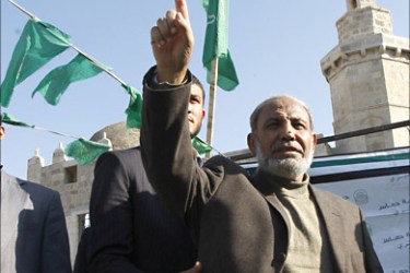 f_Hamas leader Mahmud Zahar joins supports of the Hamas movement during a demonstration on Decmber 24, 2010, in Khan Yunis, in the central Gaza Strip, calling for Hamas and