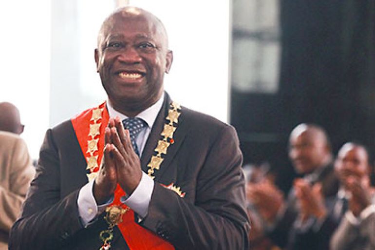 President Laurent Gbagbo gestures during his swearing-in ceremony at the Presidential Palace in Abidjan, Ivory Coast