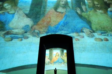 epa- A man looks at the large scale video art installation 'Leonardo's Last Supper A Vision by Peter Greenaway' at the Park Avenue Armory in New York, New York, USA, 07 December 2010