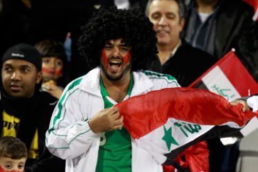 An Iraq fan cheers before their 2011 Asian Cup Group D soccer match against Iran at Al Rayyan stadium in Doha January 11, 2011.