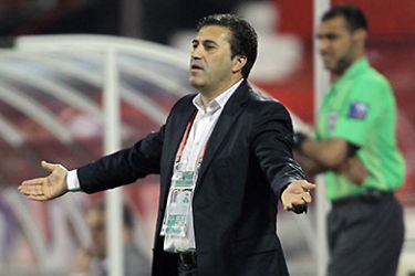 Doha, -, QATAR : Saudi Arabia's coach Jose Peseiro gives instructions to his players during their 2011 Asian Cup group B football match against Syria in the Qatari capital Doha on January 9, 2011. AFP PHOTO
