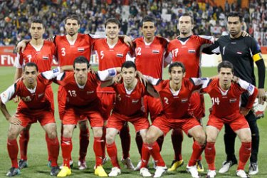Syria's national soccer team poses for a group picture before their 2011 Asian Cup Group B soccer match against Japan at Qatar Sports Club stadium in Doha January 13, 2011. From L-R (bottom row) Samer Aouad, Nadim Sabag, Jehad Al Hussien, Belal Abduldaim, Wael Ayan, (top row) Abdulrazak Al Husein, Ali Dyab, Feras Ismail, Mohamad Al Zino, Abulkader Deka and Mosab Balhous.
