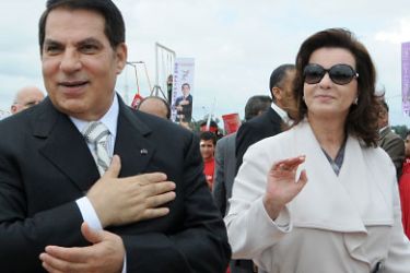 picture taken on October 11, 2009 shows then Tunisian President Zine El Abidine Ben Ali and his wife Leila during the presidential election campaign at Rades stadium near Tunis. Tunisia's Constitutional Council on Saturday declared parliament speaker Foued Mebazaa the country's new interim president, ruling out any