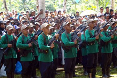 Photo taken on December 26, 2010 shows Communist rebels standing in formation during the 42nd anniversary of the founding of the Communist Party of the Philippines on the southern island of Mindanao.