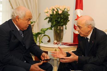 Tunisian Prime Minister Mohamed Ghannouchi (R) meets Tunisia's opposition left-wing Ettajdid (Renewal) party leader Ahmed Brahim