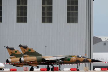 Two Libyan Air Force Mirage F1 fighter jets are seen on the apron at Malta International Airport outside Valletta, February 26, 2011. The Libyan government has formally requested the return of the two fighter jets flown to Malta by defecting pilots on February 21, according to local media.