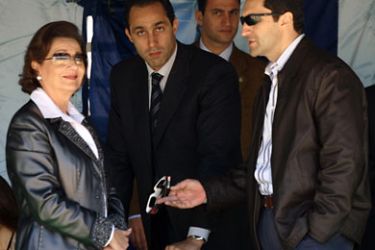 -- File picture dated March 29, 2006 shows Egypt's First Lady Suzanne Mubarak and her sons Gamal (C) and Alaa (R) standing under a tent as they wait for the fourth total solar eclipse of the 21st century in Sallum, on the border with Libya in northwestern Egypt.