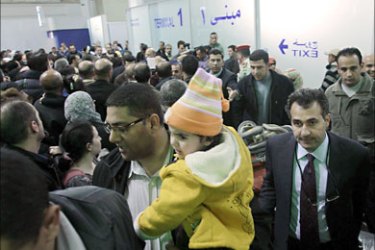 epa02595365 Jordanian families arrive at Queen Alia International Airport near Amman, Jordan, on 21 February 2011. Around 260 Jordanians evacuated from Tripoli,