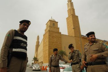 Policemen stand outside al Rajhi Mosque in Riyadh March 11, 2011. Police flooded the streets of the Saudi capital on Friday looking to deter a planned day of demonstrations and small protests were reported in the east of the oil-rich country that has been rattled by pan-Arab unrest.