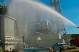 r_A fire truck sprays water at No. 3 reactor of the Fukushima Daiichi nuclear power plant in Tomioka, Fukushima prefecture in this still image taken from a video by the Self
