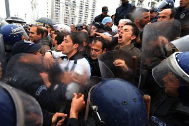 Policemen block demonstrators who attempted to stage a rally, on March 12, 2011 in Algiers. Police in Algeria launched a massive security operation to head off marchers calling for an immediate end to President Abdelaziz Bouteflika's regime