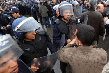 Policemen block demonstrators who attempted to stage a rally, on March 12, 2011 in Algiers. Police in Algeria launched a massive security operation to head off marchers calling for an immediate end to President Abdelaziz Bouteflika's regime.