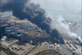 r_Black smoke rises from fires after a magnitude 8.9 earthquake and tsunami struck Shiogama, Miyagi Prefecture in northern Japan March 13, 2011