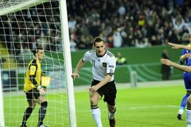 Germany's striker Miroslav Klose (C) celebrates scoring during the EURO 2012 qualifying match Germany vs Kazakhstan in the southern German city of Kaiserslautern on March 26, 2011. AFP