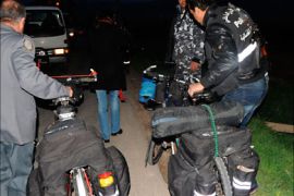 r_Lebanese policemen carry bikes belonging to kidnapped European bikers in Zahleh town in the eastern Bekaa valley March 23, 2011