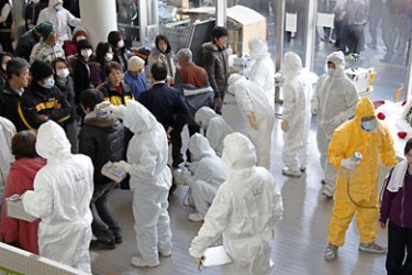Evacuees from the west side of Fukushima, receive radiation scans in Nihonmatsu city in Fukushima prefecture, on March 16, 2011. The official toll of the dead and missing following