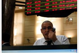 r_A trader works at the Egyptian Stock Exchange in Cairo March 23, 2011. The Egyptian stock exchange's broad index tumbled 9 percent on Wednesday after the bourse reopened