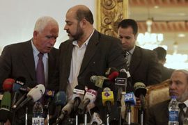 r_Azzam al-Ahmad, head of the Fatah group (L), changes seats with Mousa Abu Marzook (C), a senior member of Hamas, near Mahmoud al-Zahar (R), a co-founder of Hamas and a member of the Hamas leadership in the Gaza Strip