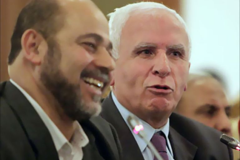 r_Azzam al-Ahmad (L), head of the Fatah group, and Mousa Abu Marzook, a senior member of Hamas, speak after a news conference in Cairo April 27, 2011