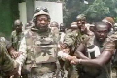 Soldiers loyal to Alassane Ouattara lead Laurent Gbagbo (C) out of the Ivory Coast Presidential Palace in Abidjan in this still image taken from video April 12, 2011. Shouts of joy erupted in parts of Abidjan on Monday as news of the arrest of Laurent Gbagbo spread through Ivory Coast's main city, where many had been trapped in their homes during 10 days of heavy fighting.