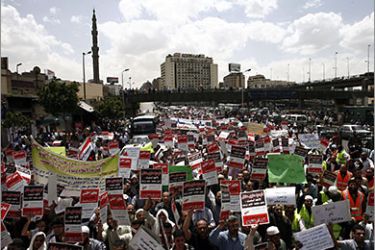 Egyptians march to St. Mark's Coptic Orthodox Cathedral in Cairo on April 29, 2011, during a demonstration to demand the release of two women they allege are being held after converting to Islam
