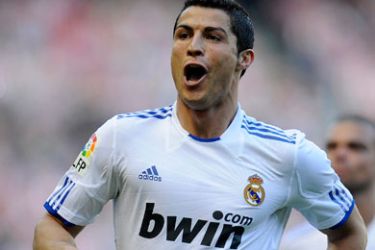 Real Madrid's Cristiano Ronaldo celebrates his goal against Athletic Bilbao during their Spanish first division soccer match at the San Mames stadium in Bilbao April 9, 2011.