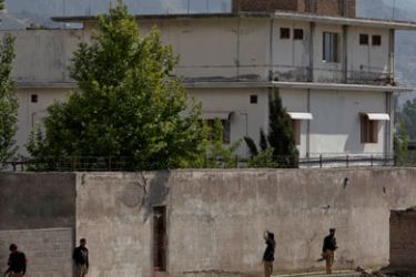 Members of the anti-terrorism squad are seen surrounding the compound where al Qaeda leader Osama bin Laden was killed in Abbottabad May 4, 2011. Bin Laden was unarmed when U.S. special forces shot and killed him, the White House said, as it tried to establish whether its ally Pakistan had helped the al Qaeda leader elude a worldwide manhunt.