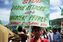 An activists of Jamaat-e-Islami Pakistan holds a placard during an anti-US protest on May 6, 2011 in Abottabad condemning the US operation in Pakistan which killed bin Laden on May 1. US drones fired a salvo of missiles into a compound in Pakistan's tribal district of North Waziristan on May 6, killing eight suspected militants including Al-Qaeda members, officials said.