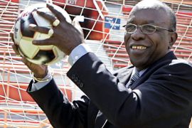 epa000474378 Jack Austin Warner of Trinidad and Tobago and President of CONCACAF handles a kick to the goal after his presentation at the CONCACAF press conference in Miami, Florida, Tuesday,