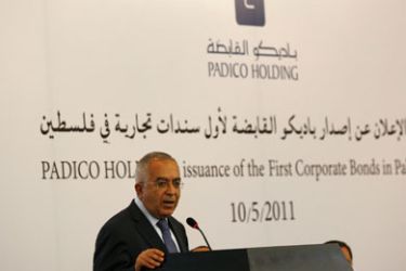 Palestinian Prime Minister Salam Fayyad speaks during Padico Holding's issuance of the first corporate bonds in the Palestinian territories in the West Bank city of Ramallah May 10, 2011.