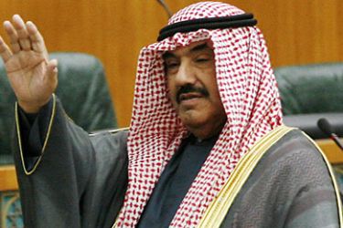 Kuwaiti Prime Minister Sheikh Nasser al-Mohammad al-Sabah gestures as he arrives to attend a parliament session at the Kuwait's National Assembly in Kuwait City on May 17, 2011, as the parliament voted to delay for one year a grilling of the Gulf state's prime minister after the government referred the case to the