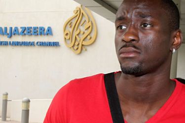 afp- France's triple jumper Teddy Tamgho stands outside the offices of Al-Jazeera satellite news channel