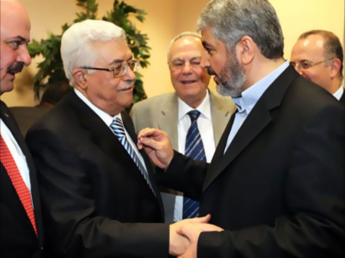 A handout picture released by the Hamas Press Office shows Palestinian president Mahmud Abbas (L) shaking hands with Hamas leader Khaled Meshaal (R) in Cairo on May 4, 2011 during a reconciliation ceremony that ended a nearly four-year feud but has angered Israel.