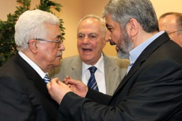 A handout picture released by the Hamas Press Office shows Palestinian president Mahmud Abbas (L) speaking with Hamas leader Khaled Meshaal in Cairo on May 4, 2011 during a reconciliation ceremony that ended a nearly four-year feud but has angered Israel.