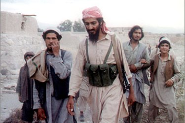 AFP (FILES) This file photo taken in 1989 shows Osama bin Laden (C) walking with Afghanis in the Jalalabad area. Al-Qaeda mastermind Osama bin Laden was killed late on May 1, 2011 in a firefight with covert US forces deep inside Pakistan, prompting President Barack Obama to declare "justice has been done" a decade after the September 11 attacks. AFP PHOTO / FILES / HO
