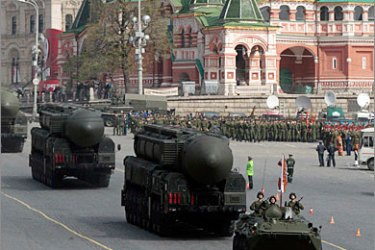 REUTERS/ Russian Topol M ballistic missiles on launchers are seen during May Day parade rehearsals in front of St. Basil's cathedral on Moscow's Red Square May 7, 2011. Russia will celebrate the 66th anniversary of victory over Nazi Germany on May 9. REUTERS/Alexander Natruskin (RUSSIA -