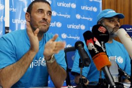 AFP Iraq's top singer Kazem al-Saher applaudes in Baghdad after being named on May 9, 2011 UNICEF's good will ambassador to Iraq