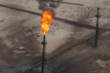 A flame is seen at Rumaila oil field in Basra, 420 km (260 miles) southeast of Baghdad May 17, 2011. Picture taken May 17, 2011.