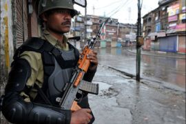 afp : An Indian Central Reserve Police Force personnel (CRPF) stands guard on a deserted street in curfew-bound Srinagar August 25, 2010. The Muslim-majority Kashmir valley has been rocked by unrest since a teenage student was killed by a police