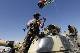 r_Rebels carry out training on a captured Gaddafi army tank in the city of Zintan June 25, 2011. REUTERS