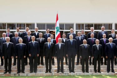 handout picture released by the Lebanese photo agency Dalati and Nohra shows Lebanon's President Michel Sleiman (C), Prime Minister Najib Mikati (5th R) and Parliament Speaker Nabih Berri (5th L) posing with ministers of the new cabinet at the presidential palace of Baabda, east of Beirut, on June 15 , 2011, two days after Mikati announced the formation of a 30-member government. AFP PHOTO/HO/DALATI AND NOHRA