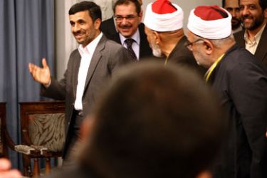 epa02761489 Iranian President Mahmoud Ahmadinejad (L) greets Egyptian scholars and activists during a meeting at the presidential office in Tehran, Iran, 01 June 2011. A delegation of Egyptian scholars and activists arrived in Tehran on 30 May 2011 to hold talks with Iranian authorities and meet with politicians.